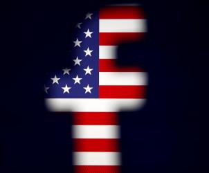 A 3D-printed Facebook logo is displayed in front of a U.S. flag in this illustration